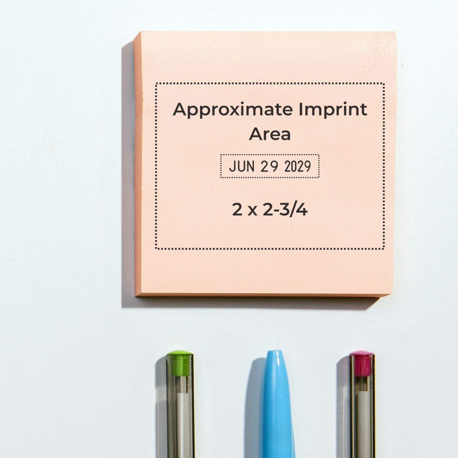 Beige self-inking stamp and seal product box labeled approximate imprint area, with green, blue, and magenta stamp parts below.