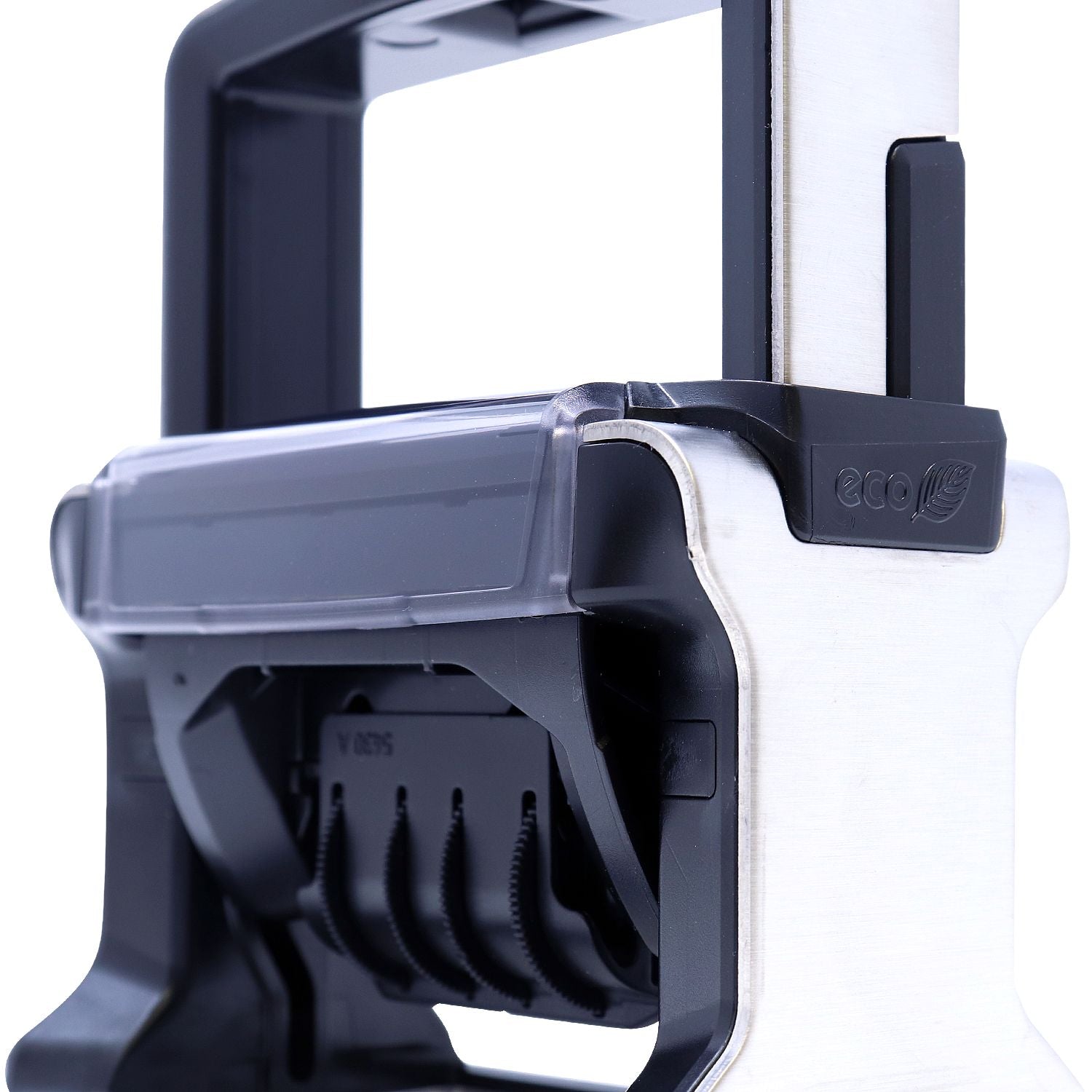 Black and silver self-inking stamp and seal device with translucent gray cover and brushed metal frame.