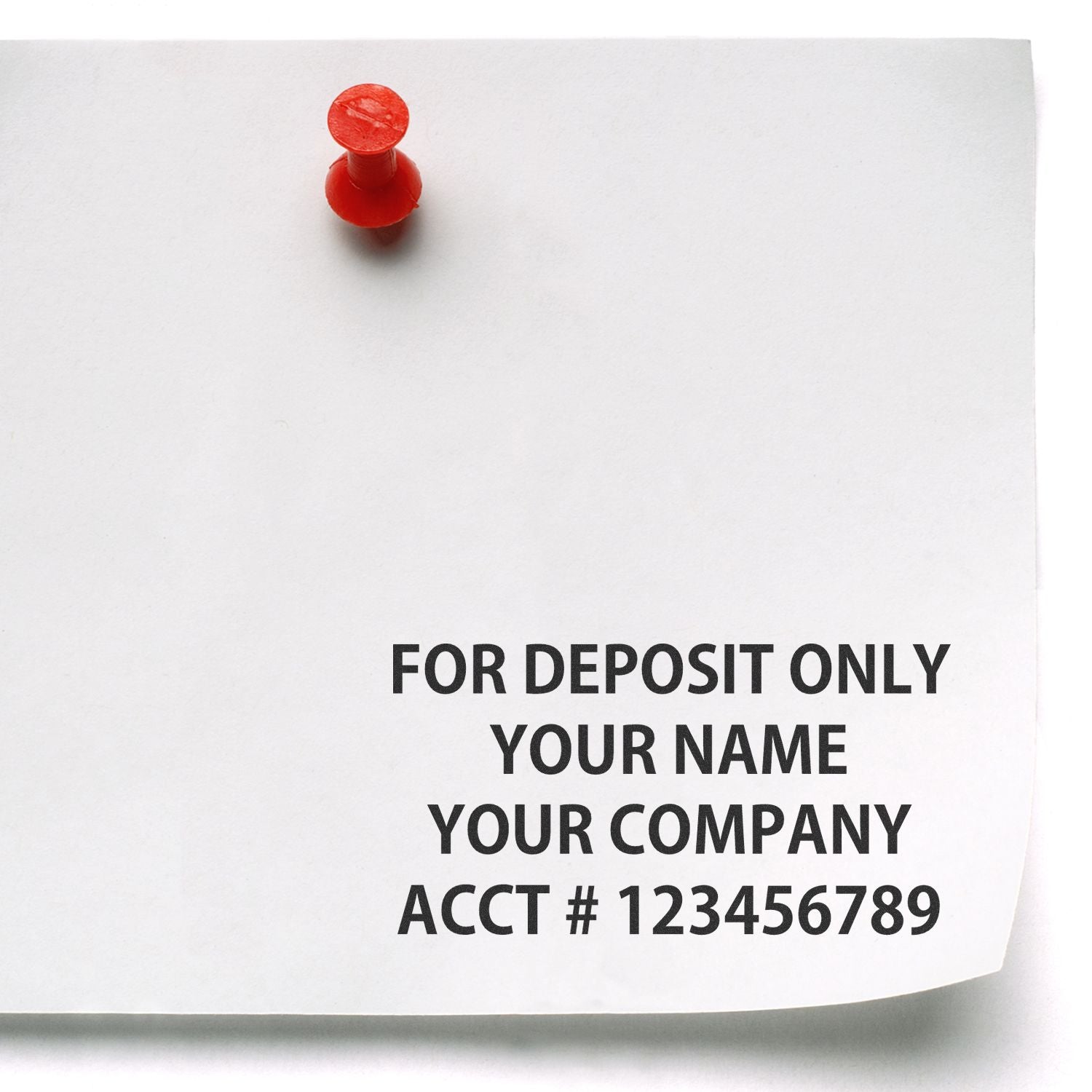 4 Line Regular Rubber Check Endorsement Stamp used on a white paper pinned with a red pushpin, displaying deposit information.