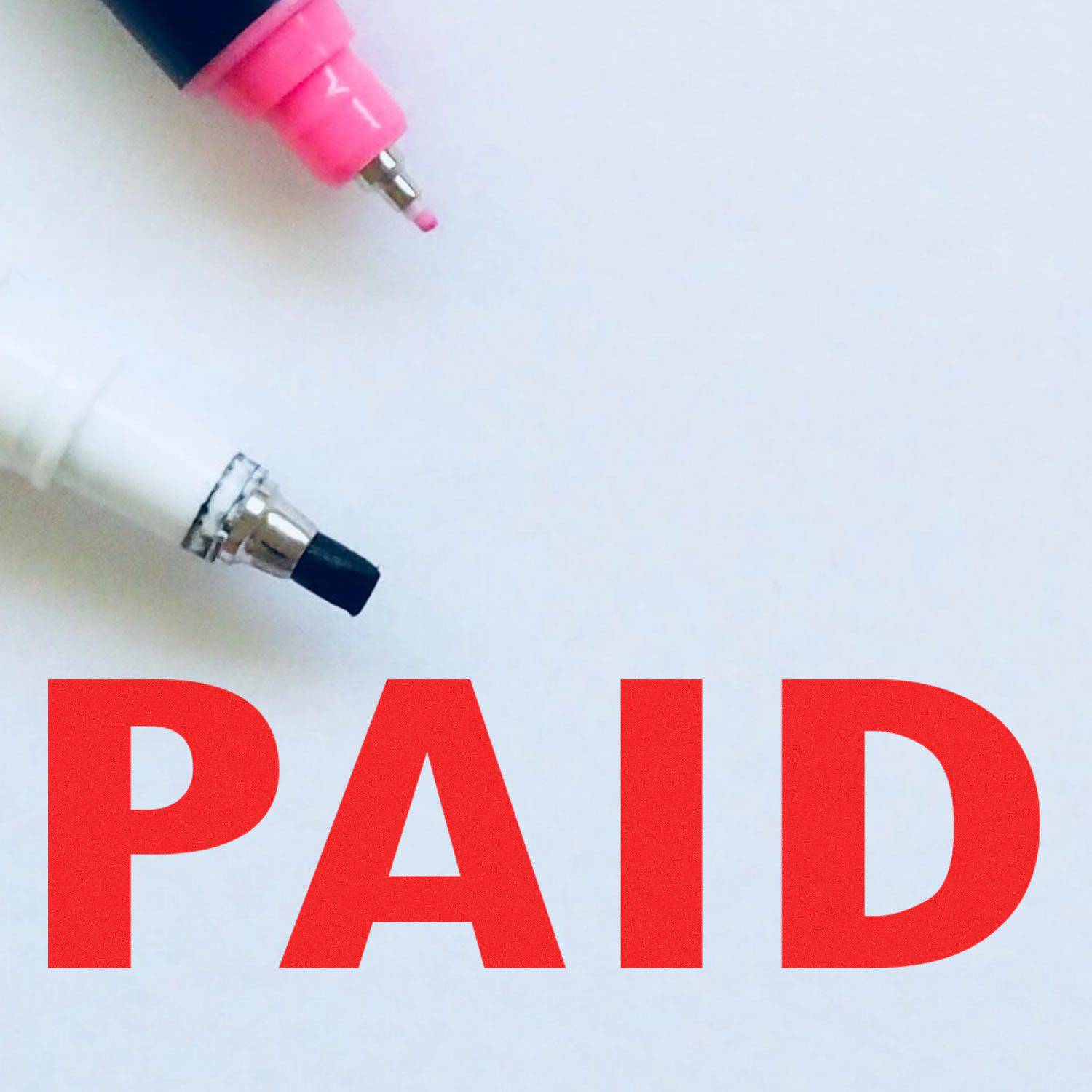 Large Pre-Inked Paid Stamp in red ink with two markers, one pink and one black, on a white background.