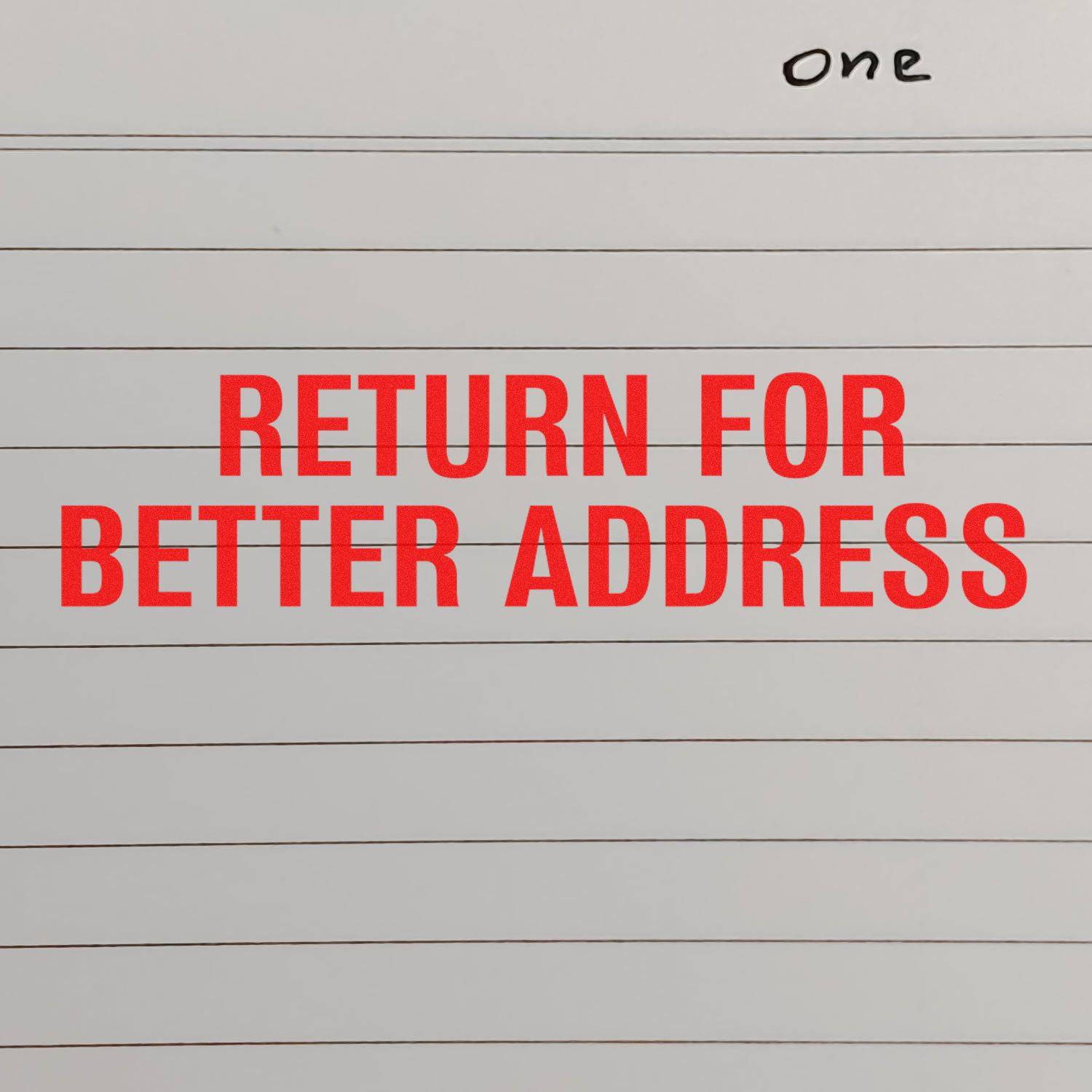 Large Pre-Inked Return for Better Address Stamp in red ink on lined paper, with the word one handwritten at the top right corner.