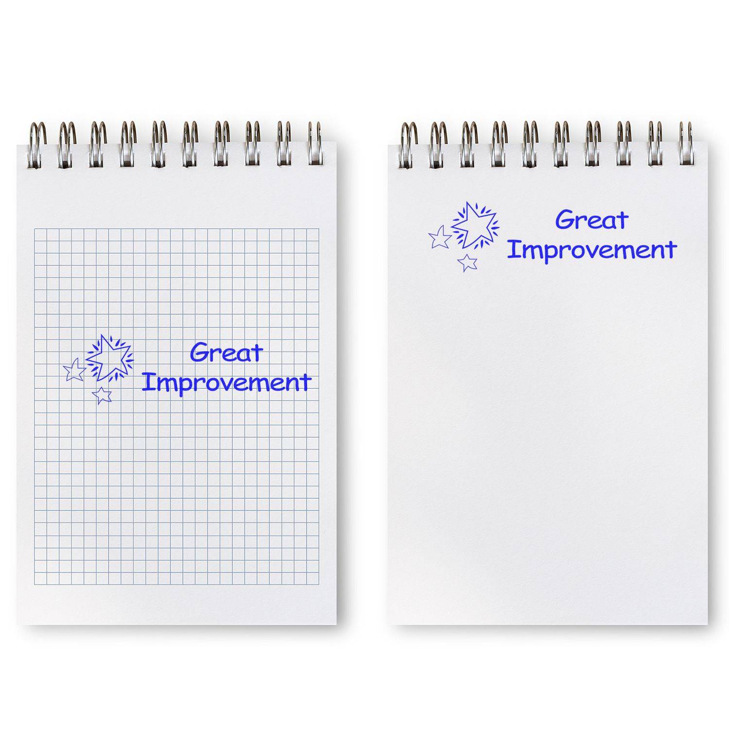 Two notepads stamped with Great Improvement using the Large Pre-Inked Great Improvement Stamp, one on graph paper and one on plain paper.