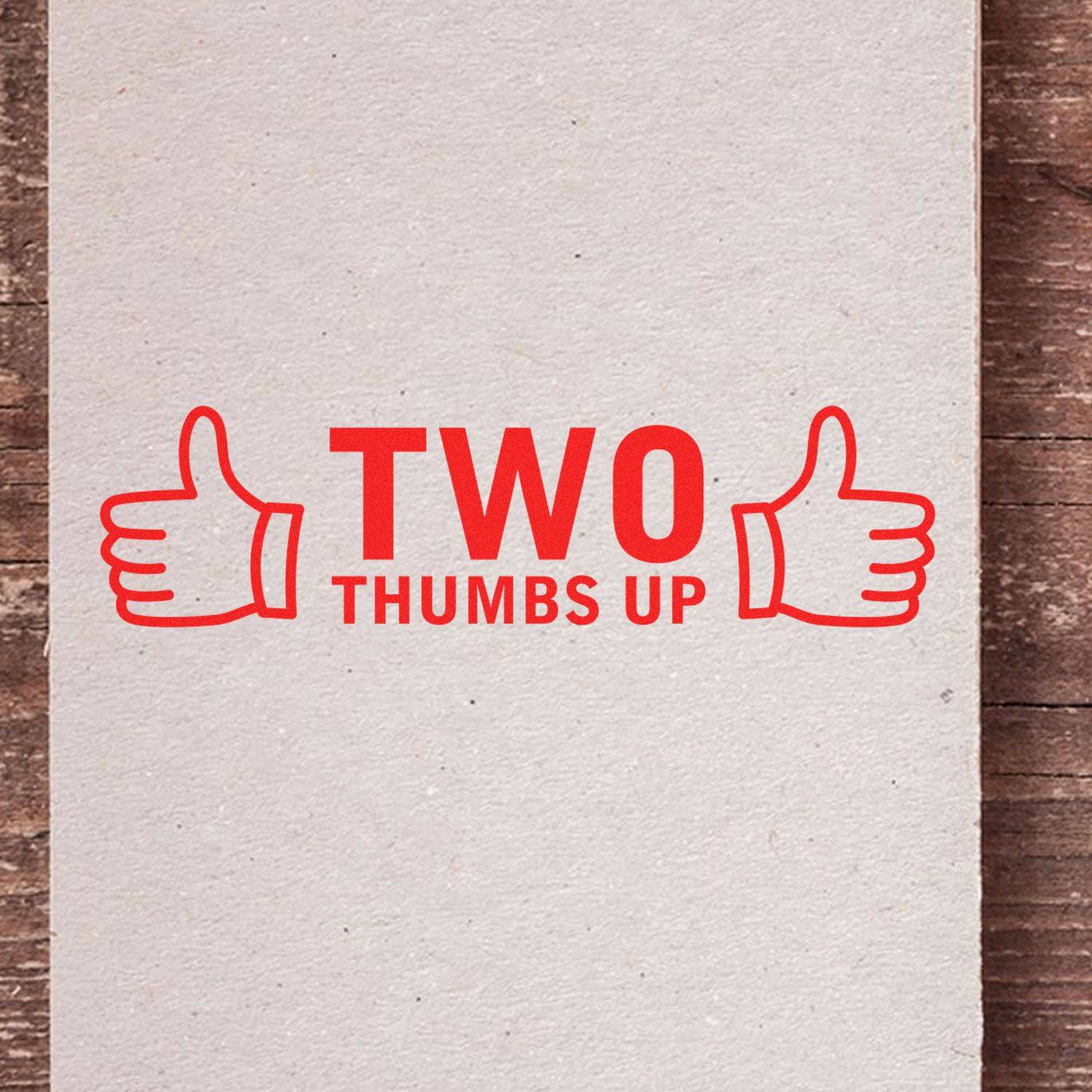 Large Pre-Inked Two Thumbs Up with Thumb Icon Stamp in red ink on a beige background, featuring two thumbs up icons and bold text.