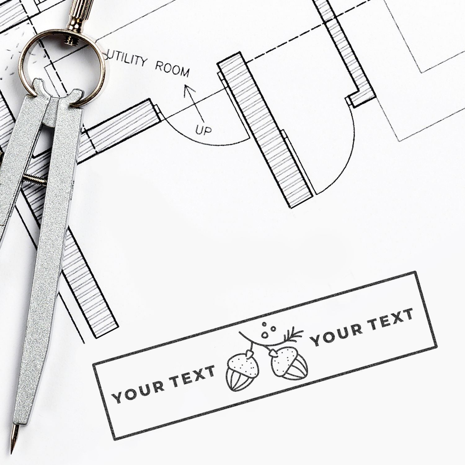 Super Slim 2054 Customized Pre-Inked Stamp 3/4 x 2 used on architectural blueprint with compass and keys nearby.