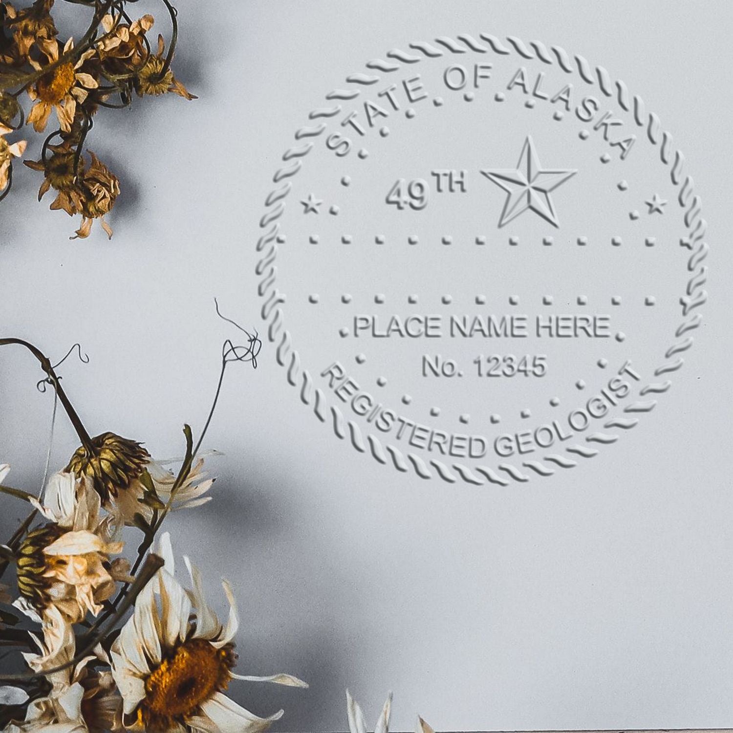 A stamped imprint of the State of Alaska Extended Long Reach Geologist Seal in this stylish lifestyle photo, setting the tone for a unique and personalized product.