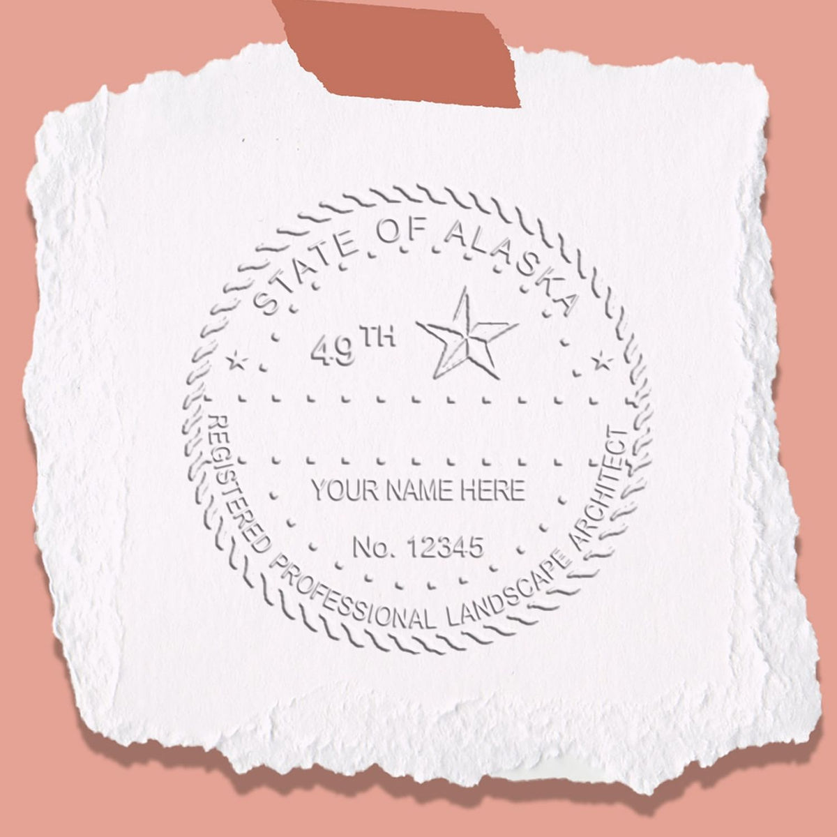 An in use photo of the Hybrid Alaska Landscape Architect Seal showing a sample imprint on a cardstock