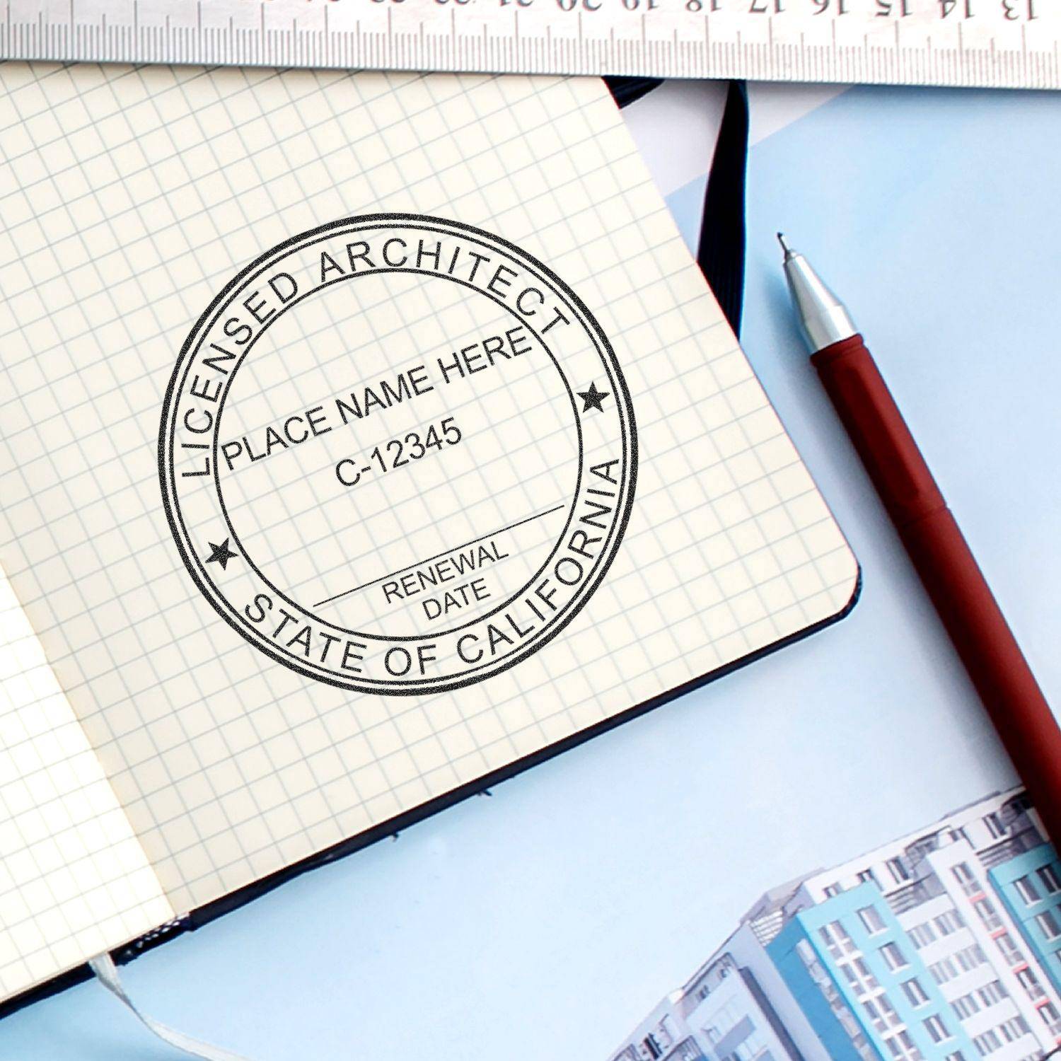 Architect Regular Rubber Stamp of Seal used on a grid notebook, displaying Licensed Architect, State of California with placeholders for name, license number, and renewal date. Pen and ruler are nearby.