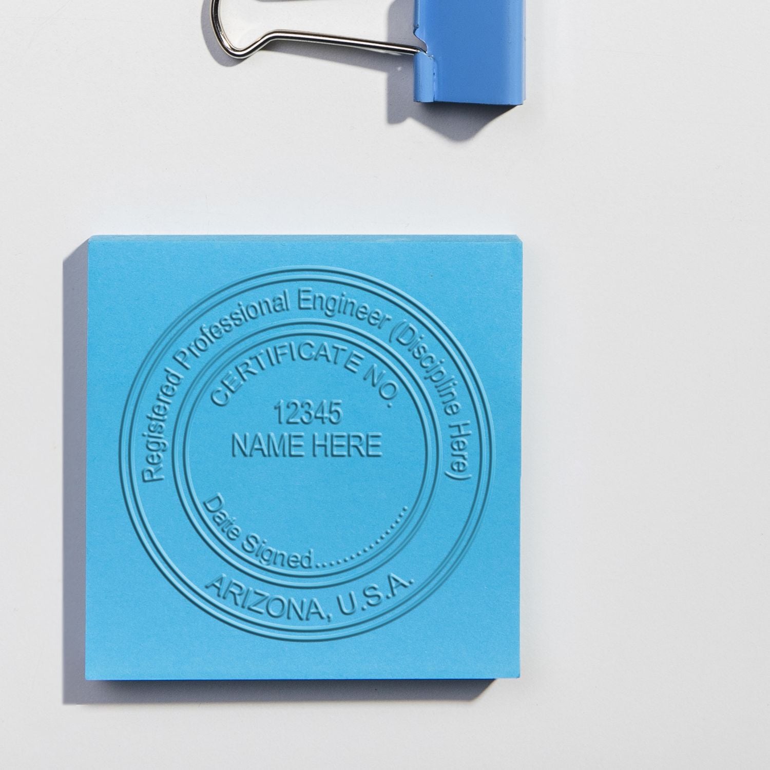 A stamped impression of the State of Arizona Extended Long Reach Engineer Seal in this stylish lifestyle photo, setting the tone for a unique and personalized product.