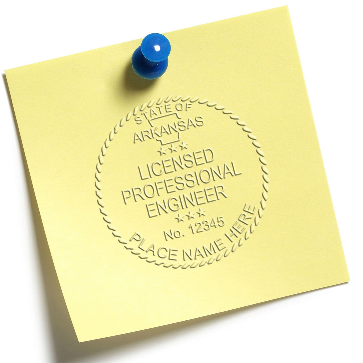 An in use photo of the Gift Arkansas Engineer Seal showing a sample imprint on a cardstock