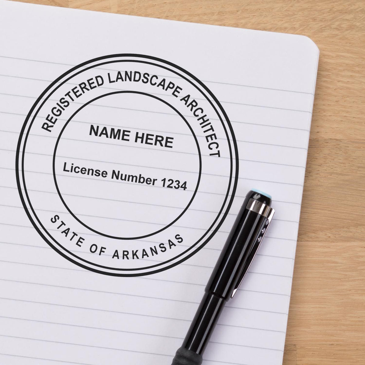A lifestyle photo showing a stamped image of the Digital Arkansas Landscape Architect Stamp on a piece of paper