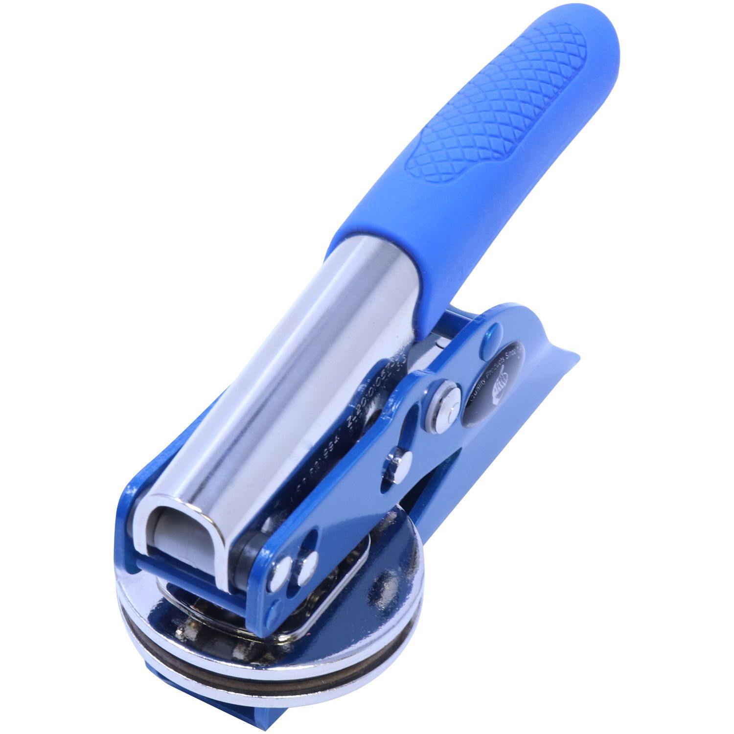 Interior Designer Blue Soft Seal Embosser with a blue handle and metal body, angled front view, showcasing the embossing mechanism.