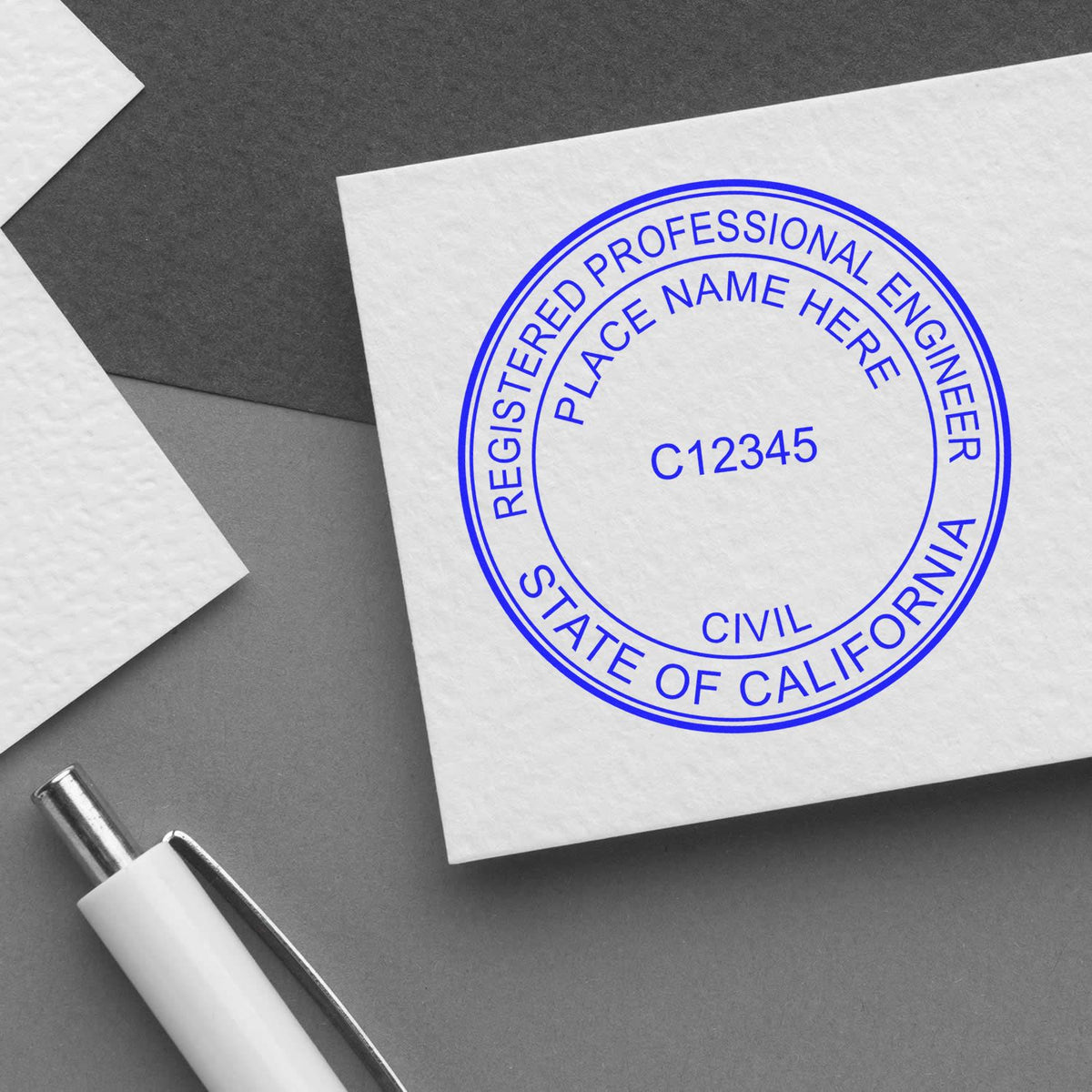 A lifestyle photo showing a stamped image of the Premium MaxLight Pre-Inked California Engineering Stamp on a piece of paper