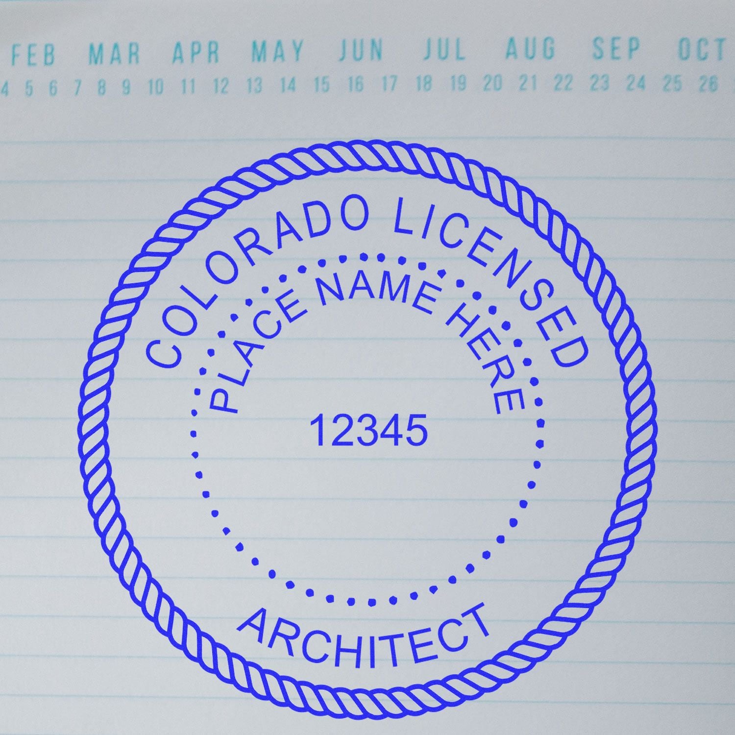 Self Inking Colorado Architect Stamp with customizable text, displayed on a lined background with a calendar header.