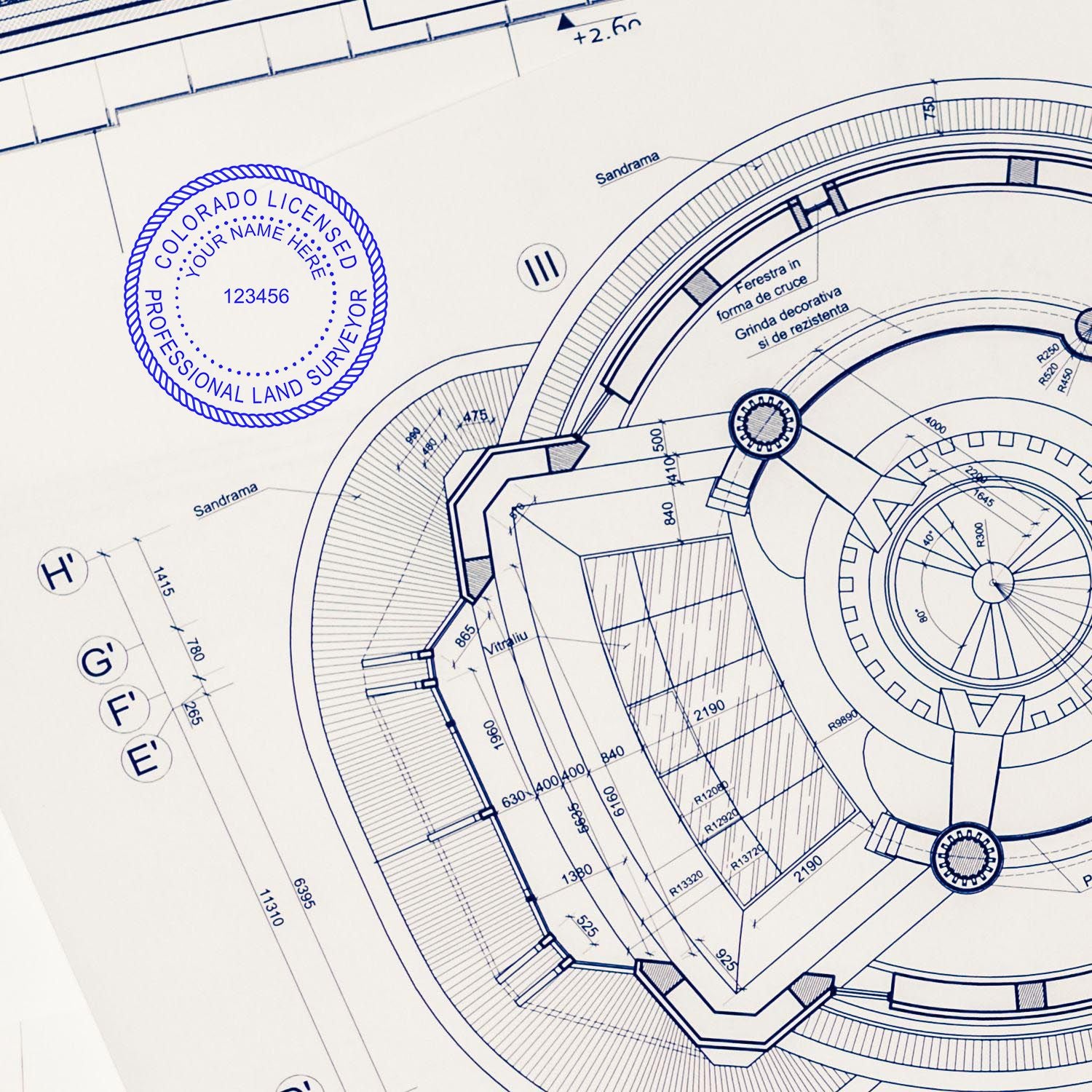 Self Inking Colorado Land Surveyor Stamp used on a detailed architectural blueprint, showing the professional seal and intricate design.