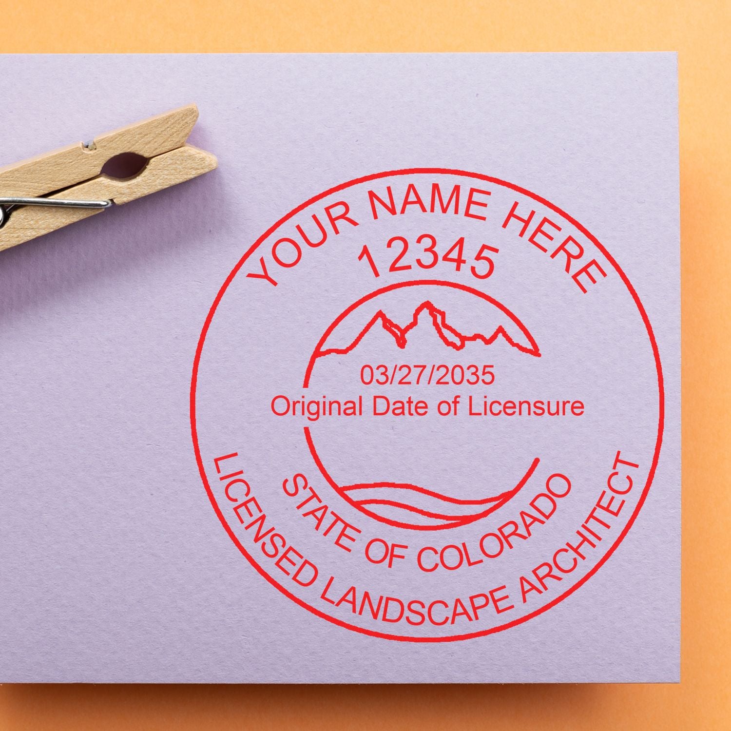 Trodat Colorado state landscape architect seal stamp, pre-inked, in use for official documents with detailed Colorado landscape design.