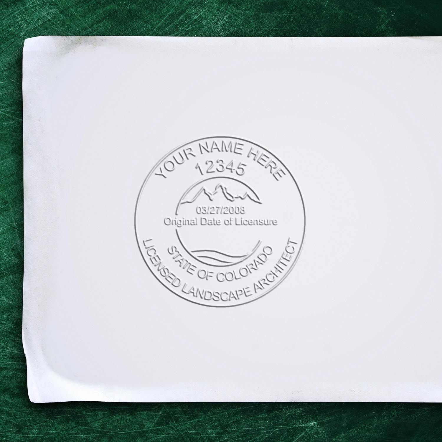 An alternative view of the Hybrid Colorado Landscape Architect Seal stamped on a sheet of paper showing the image in use