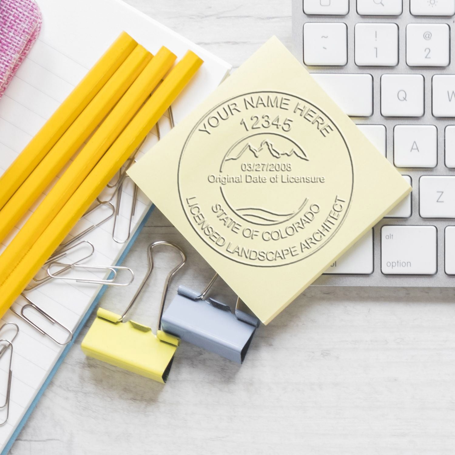 A photograph of the Colorado Desk Landscape Architectural Seal Embosser stamp impression reveals a vivid, professional image of the on paper.