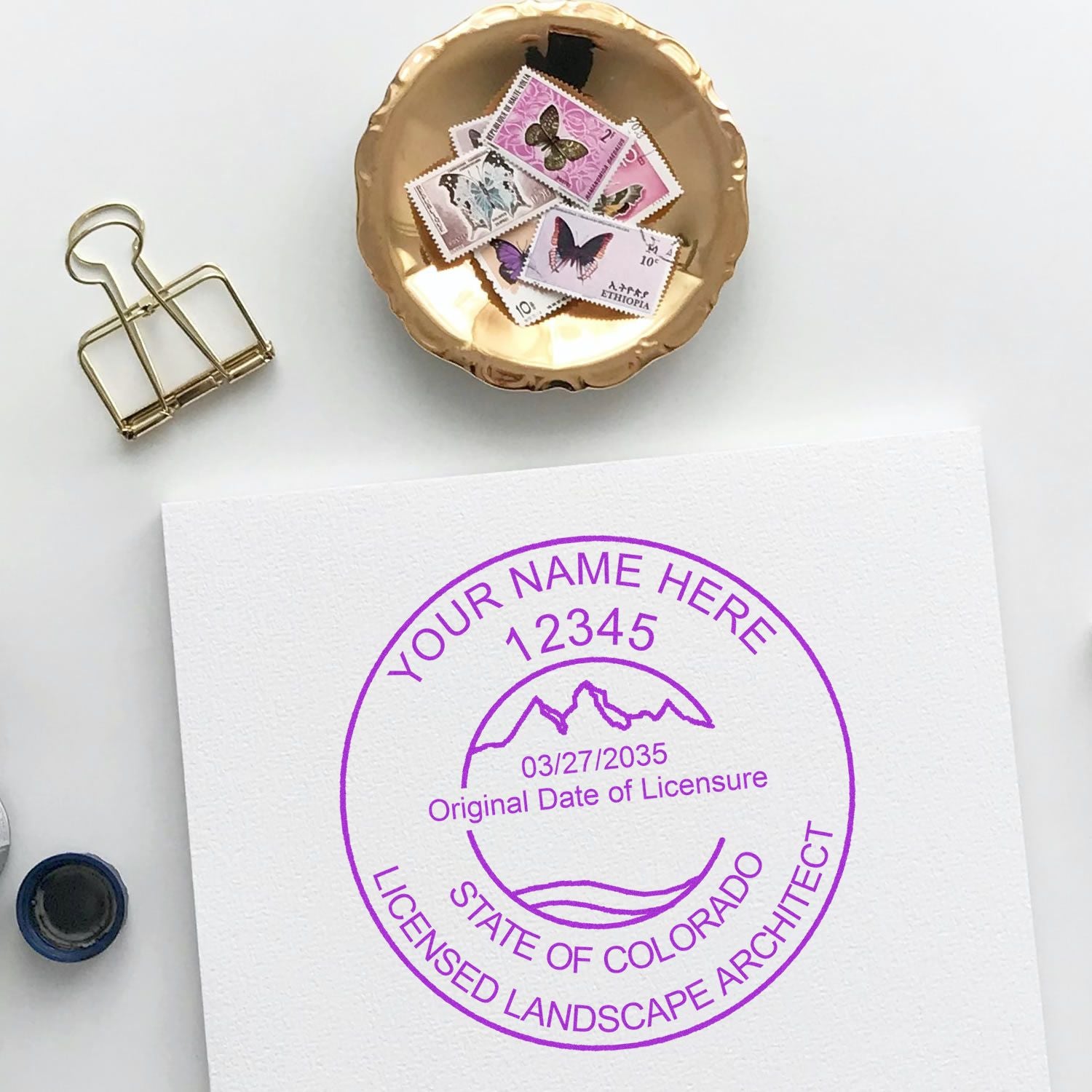 Trodat Slim Pre-Inked Colorado Landscape Architect Seal Stamp in use, featuring detailed Colorado state landscape design.