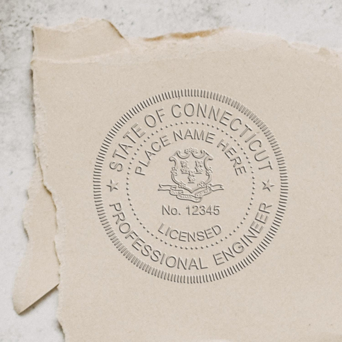 An alternative view of the State of Connecticut Extended Long Reach Engineer Seal stamped on a sheet of paper showing the image in use