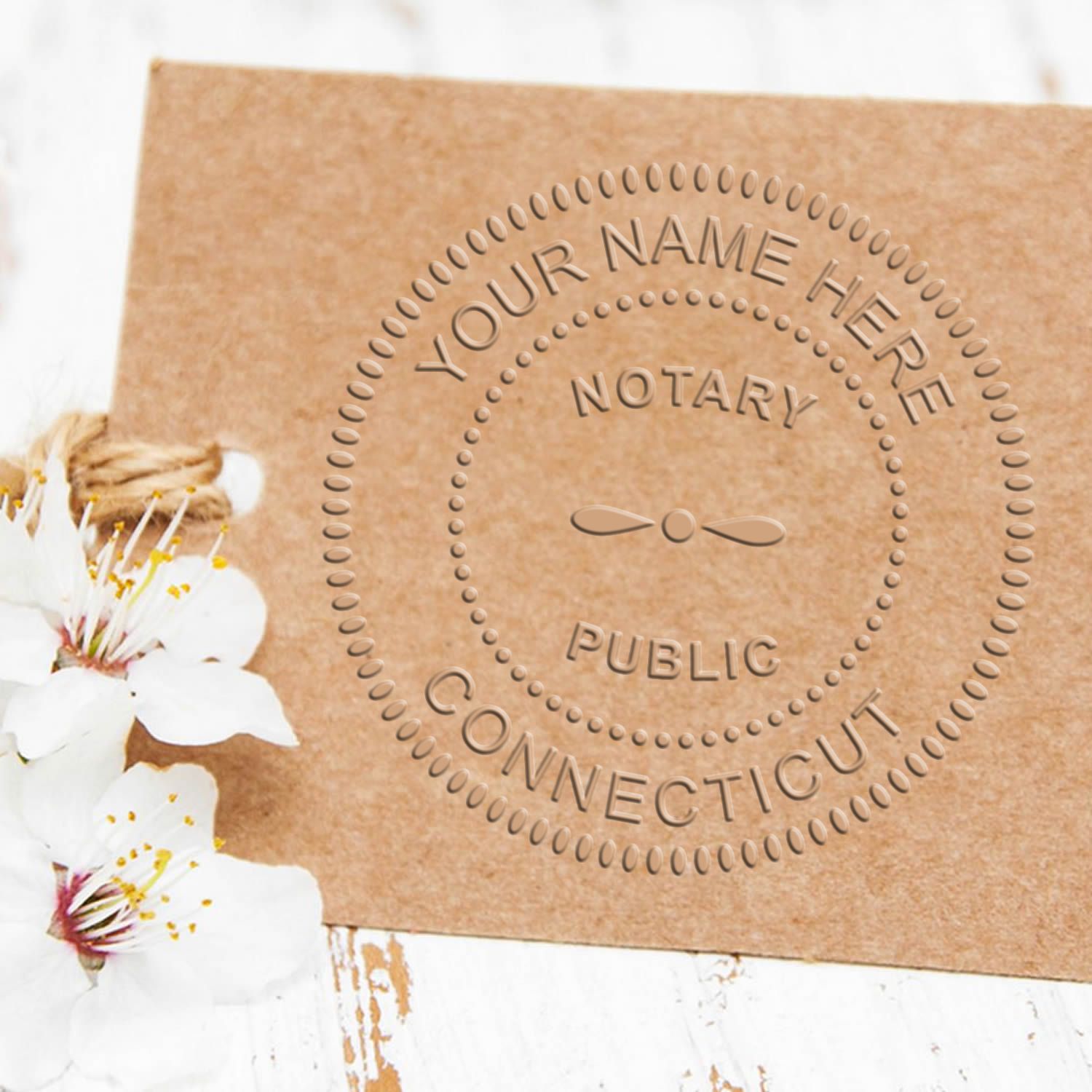 This paper is stamped with a sample imprint of the Pink Hybrid Connecticut Notary Embosser, signifying its quality and reliability.