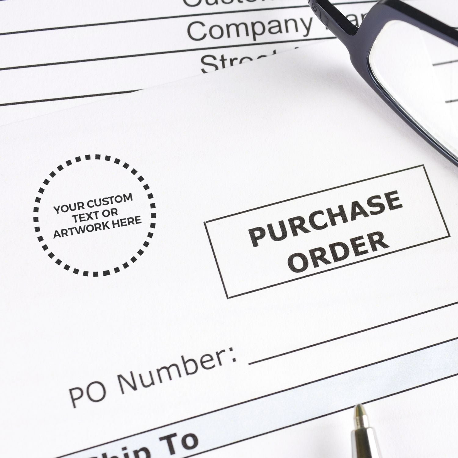 Custom Self Inking Stamp Trodat 4612 Size 1/2 Diameter used on a purchase order form, with glasses and a pen nearby.