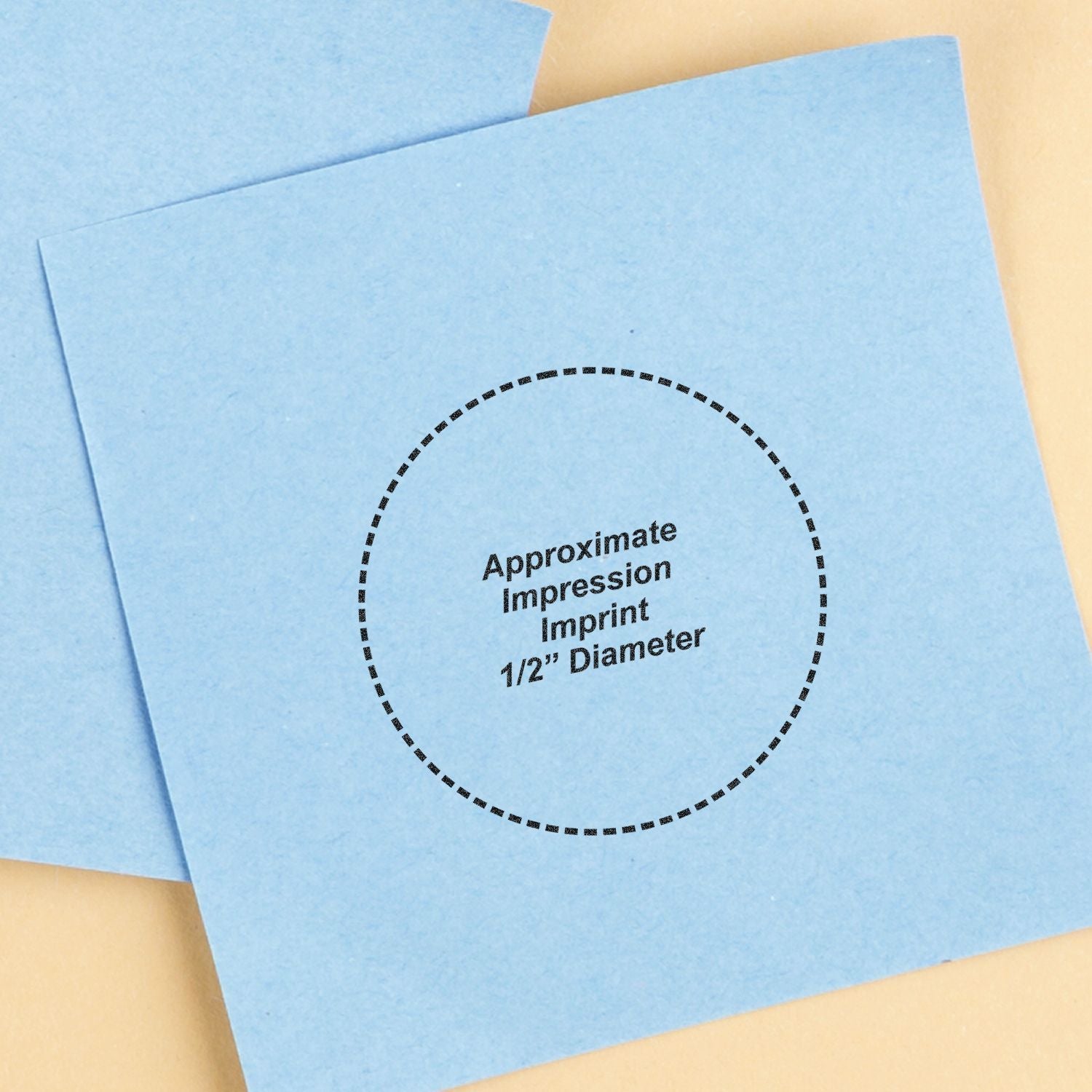 Blue paper with a circular imprint from the Custom Self Inking Stamp Trodat 4612, showing Approximate Impression Imprint 1/2 Diameter .