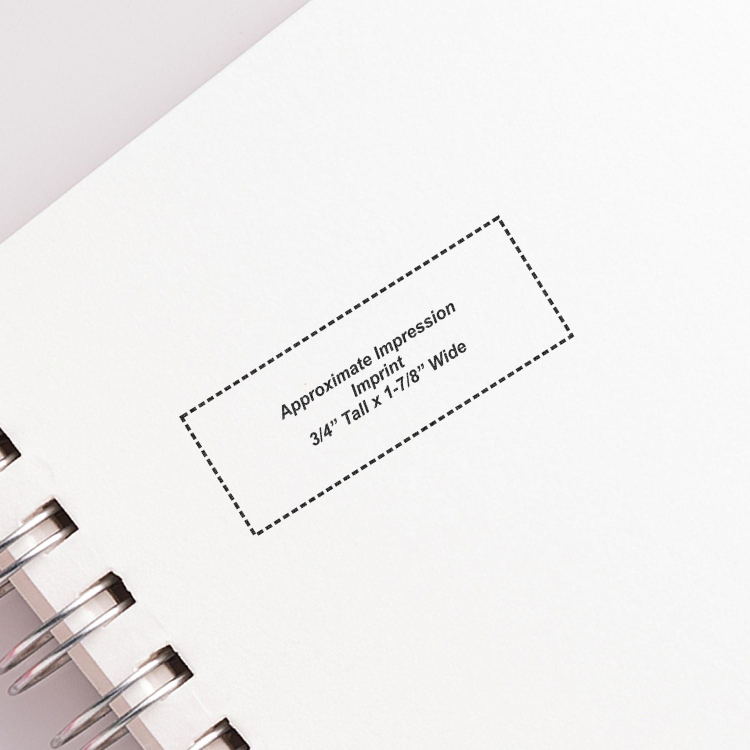 Image of a notebook with a stamped impression showing the dimensions of the 3 Line Address Stamp - Regular Rubber Stamp, 3/4 tall x 1-7/8 wide.