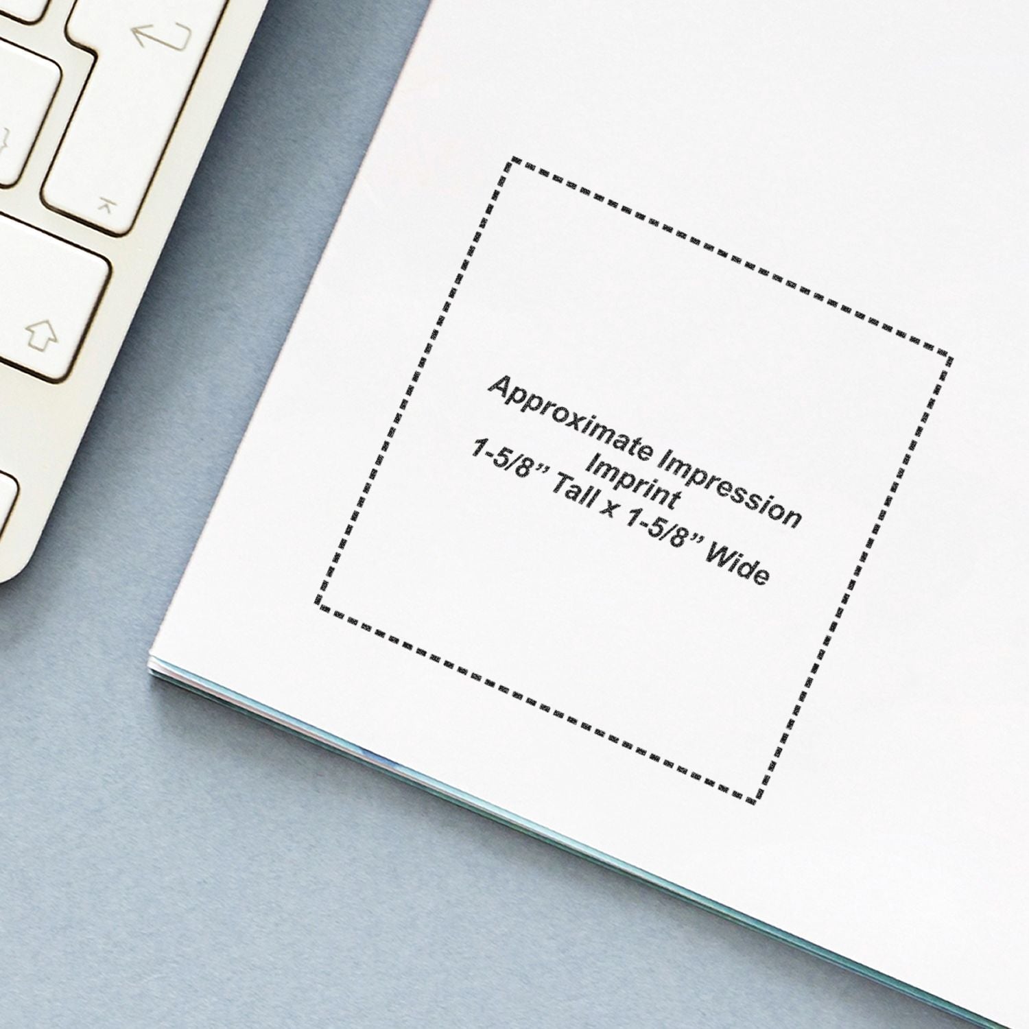 Custom Self Inking Stamp Trodat 4924 Size 1-5/8 x 1-5/8 imprint on white paper next to a keyboard.