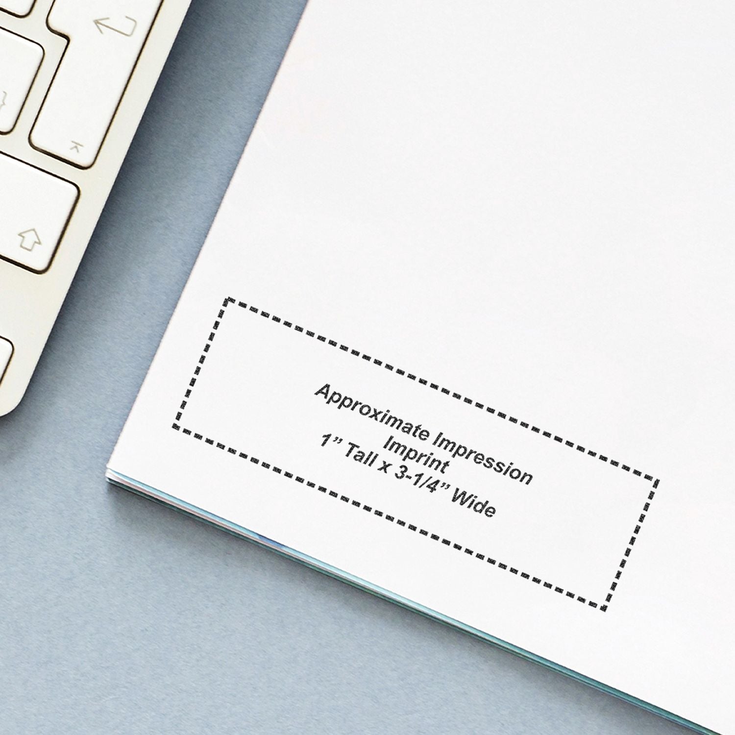 Custom Self Inking Stamp Trodat 4925 Size 1 x 3-1/4 shown on paper with approximate impression imprint dimensions. Keyboard partially visible.