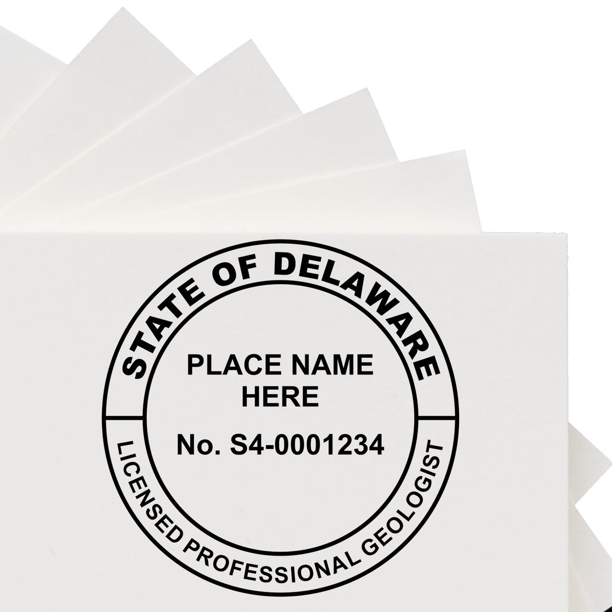 A lifestyle photo showing a stamped image of the Slim Pre-Inked Delaware Professional Geologist Seal Stamp on a piece of paper