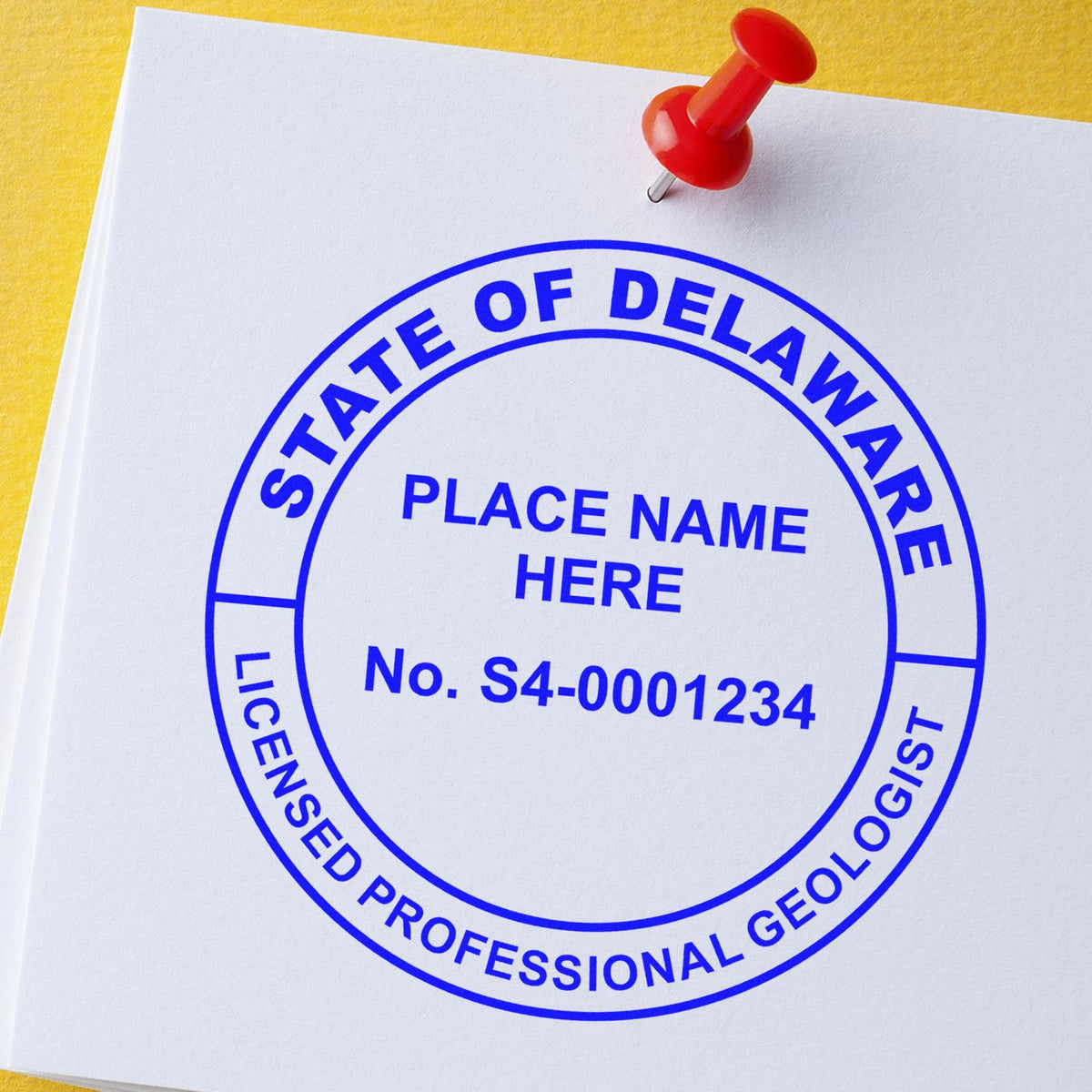 An alternative view of the Slim Pre-Inked Delaware Professional Geologist Seal Stamp stamped on a sheet of paper showing the image in use