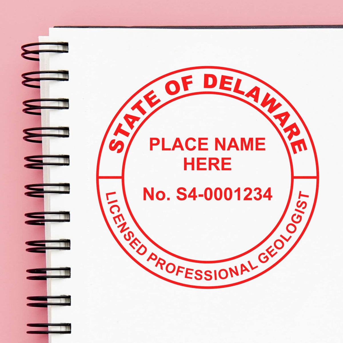 An in use photo of the Delaware Professional Geologist Seal Stamp showing a sample imprint on a cardstock