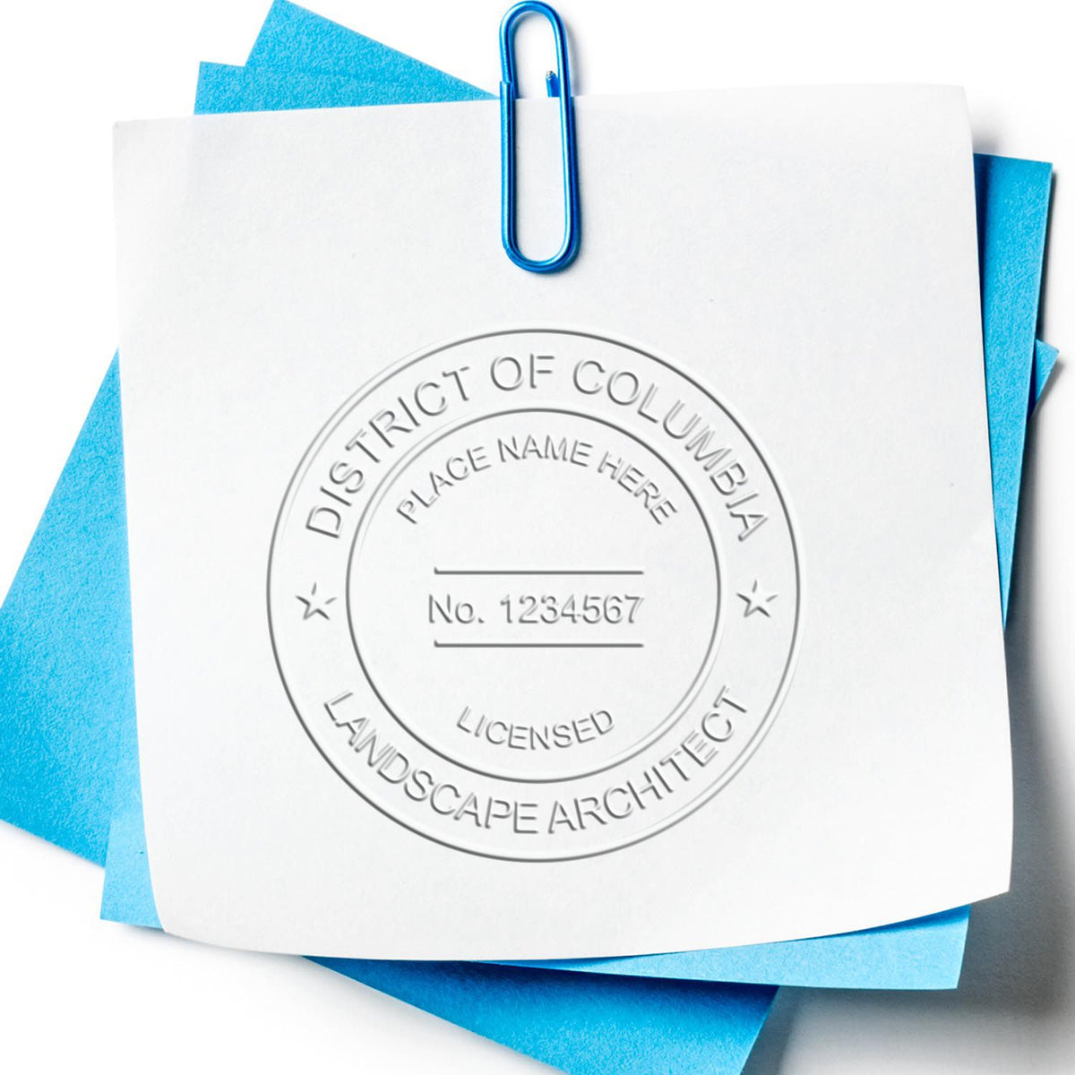 An in use photo of the Hybrid Delaware Landscape Architect Seal showing a sample imprint on a cardstock