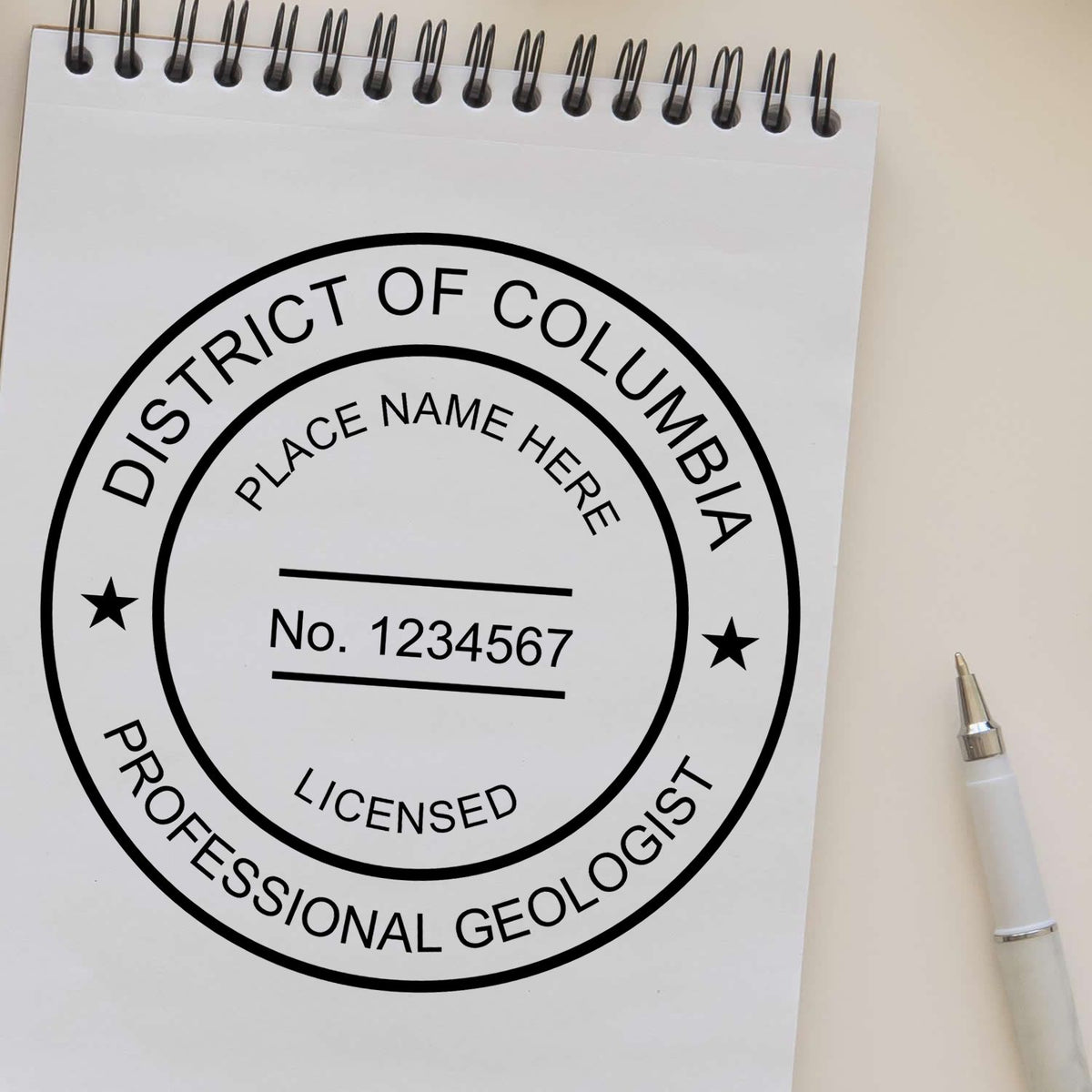 A lifestyle photo showing a stamped image of the Slim Pre-Inked District of Columbia Professional Geologist Seal Stamp on a piece of paper