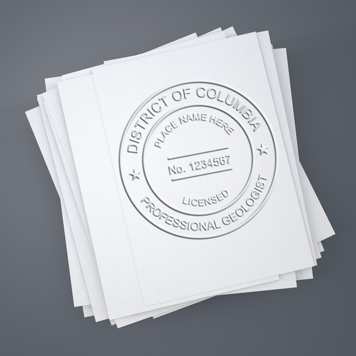 An in use photo of the Soft District of Columbia Professional Geologist Seal showing a sample imprint on a cardstock