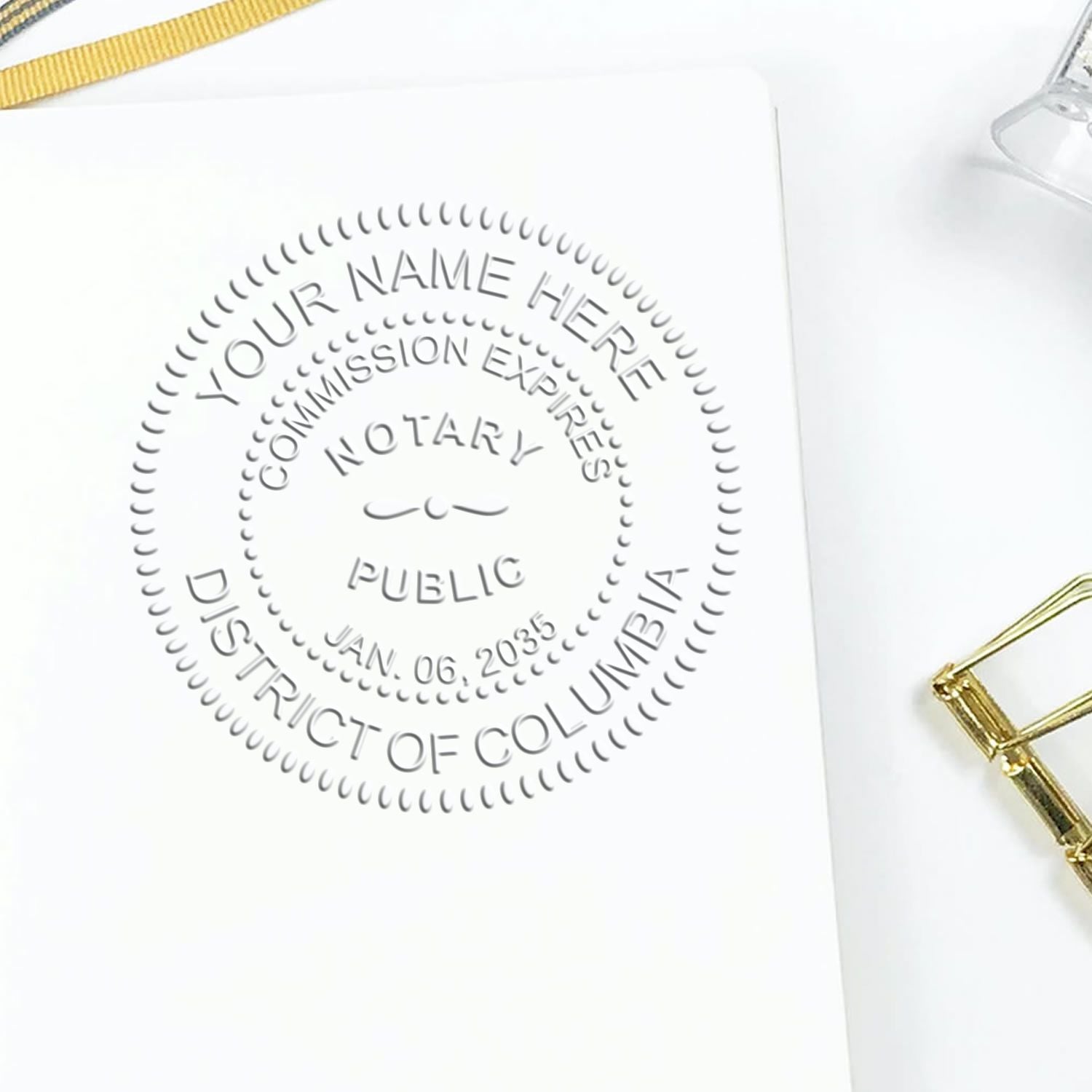 A stamped impression of the District of Columbia Desk Notary Public Seal in this stylish lifestyle photo, setting the tone for a unique and personalized product.