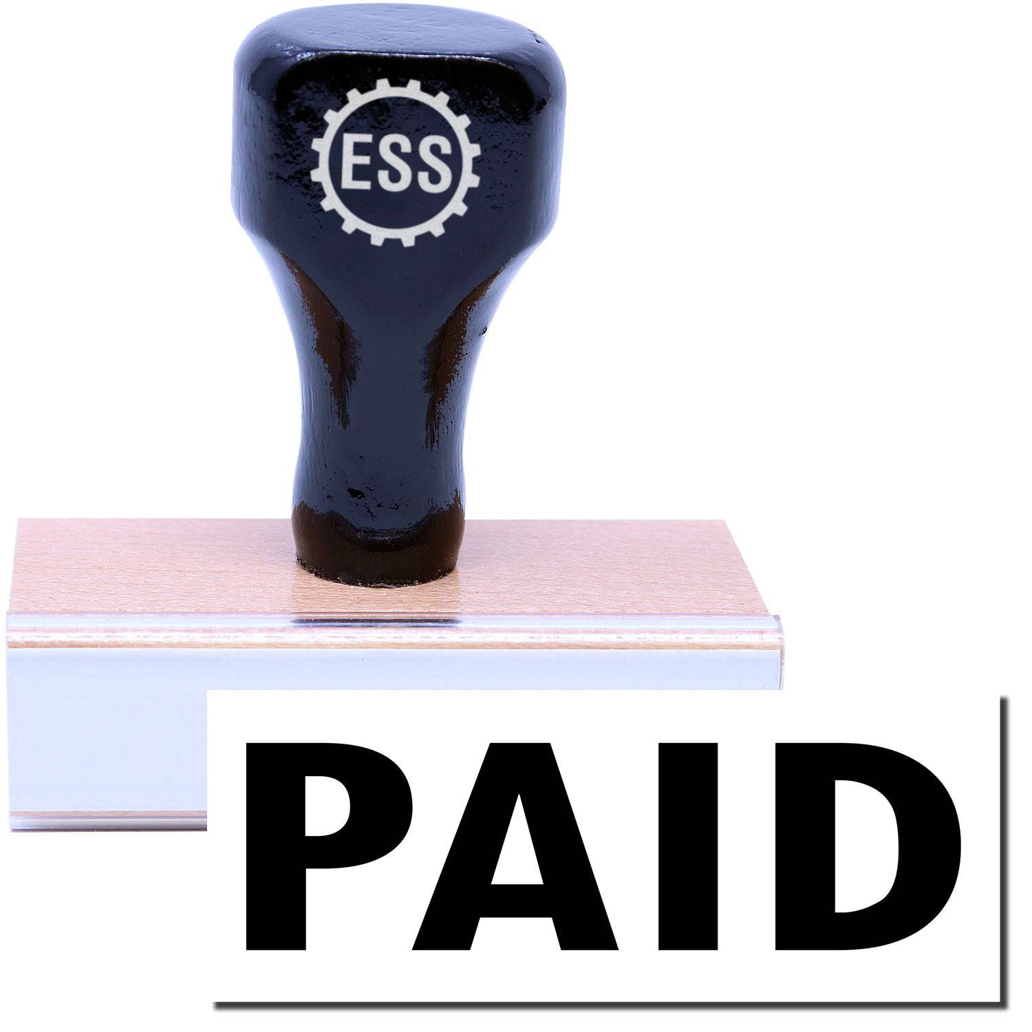 A stock office rubber stamp with a stamped image showing how the text PAID in a large font is displayed after stamping.