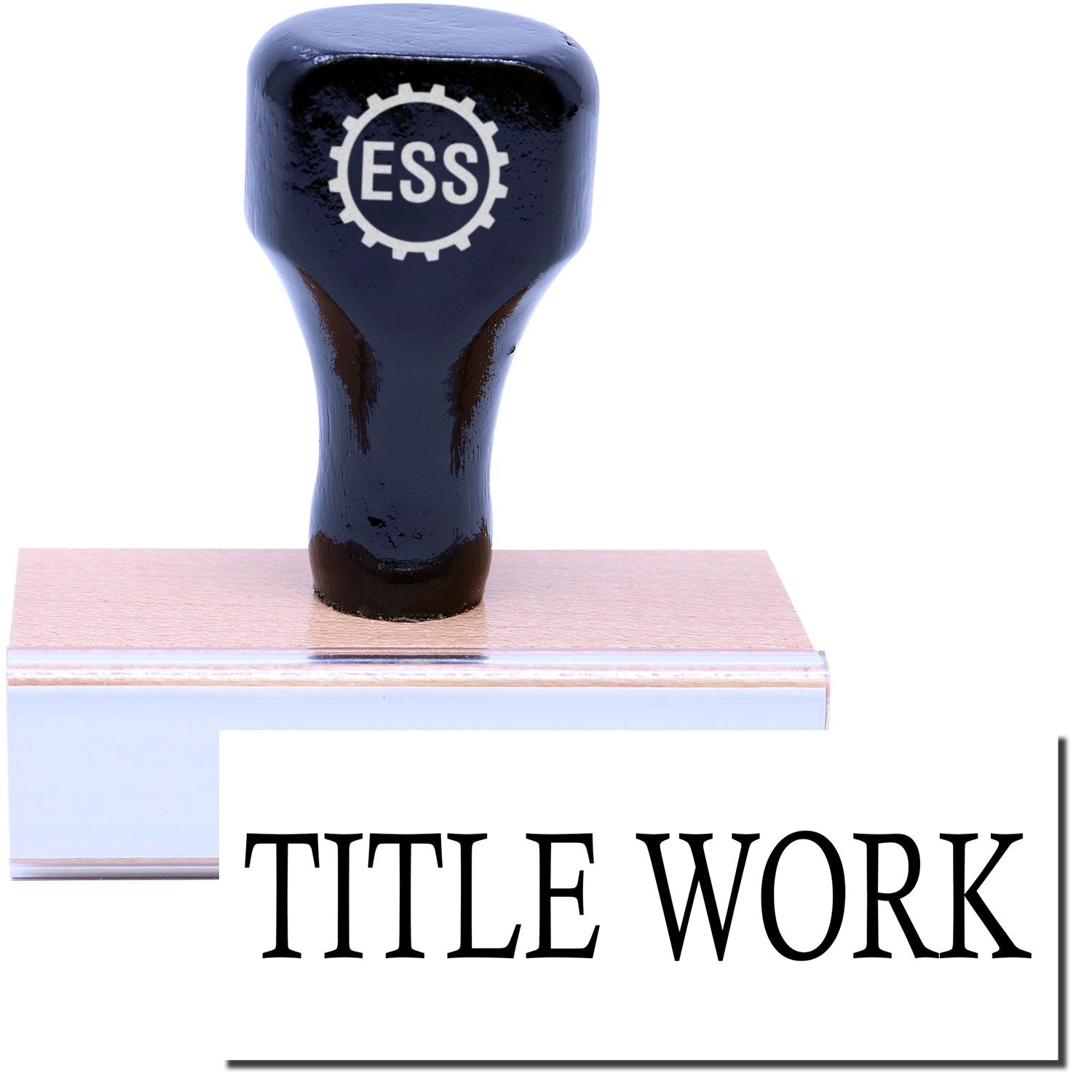 A stock office rubber stamp with a stamped image showing how the text TITLE WORK in a large font is displayed after stamping.