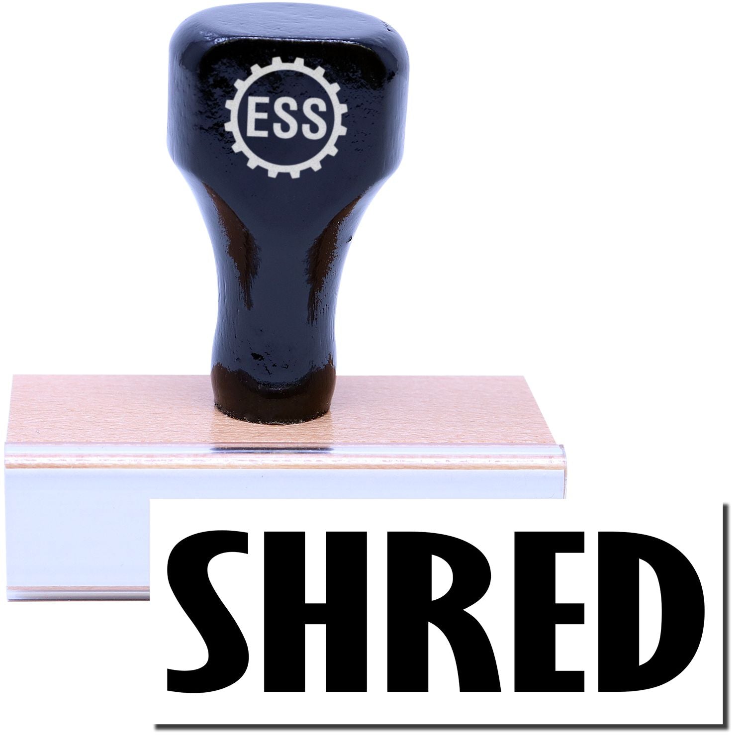 A stock office rubber stamp with a stamped image showing how the text SHRED in a large font is displayed after stamping.
