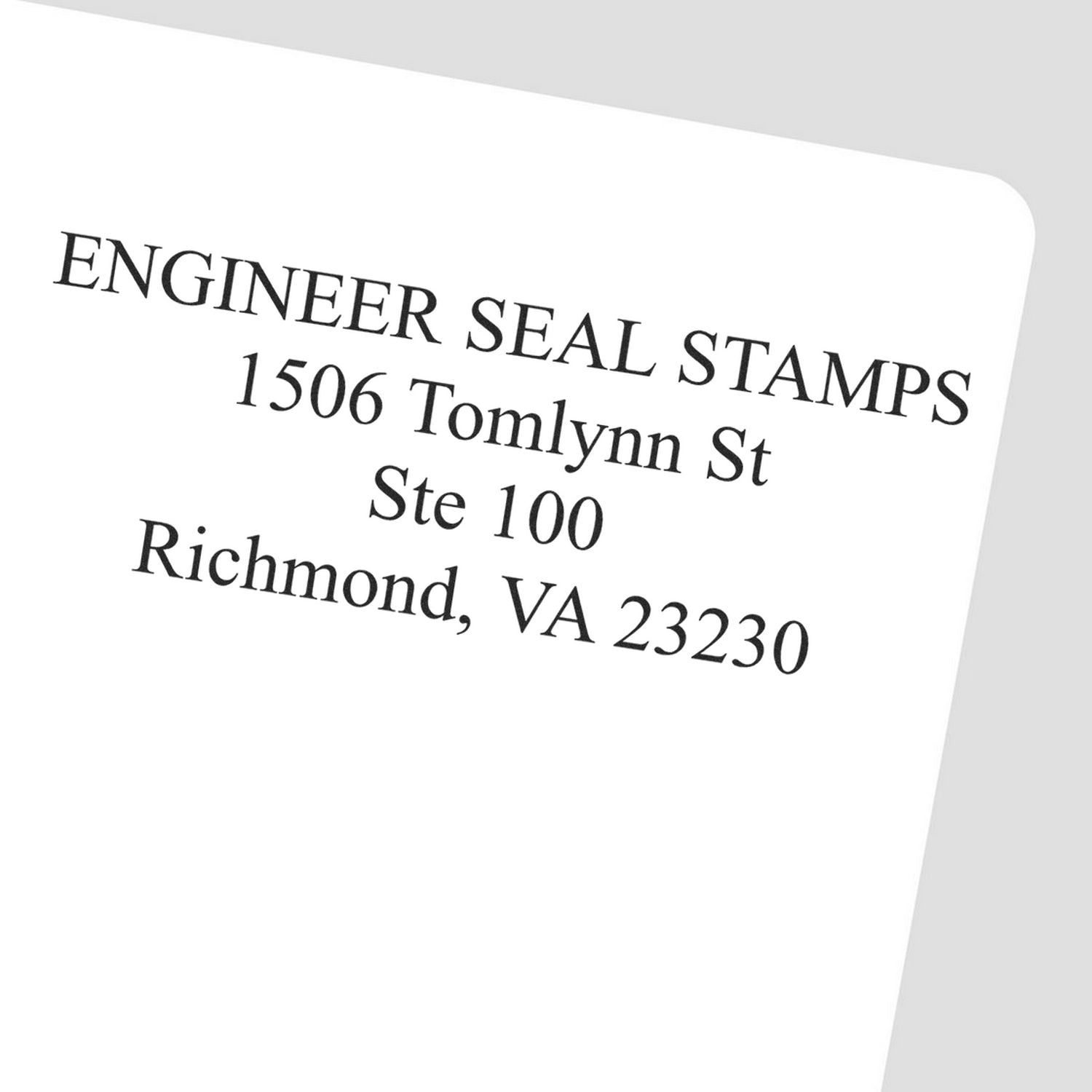 4 Line Address Stamp Regular Rubber Stamp imprint on a white paper showing ENGINEER SEAL STAMPS, 1506 Tomlynn St, Ste 100, Richmond, VA 23230 .