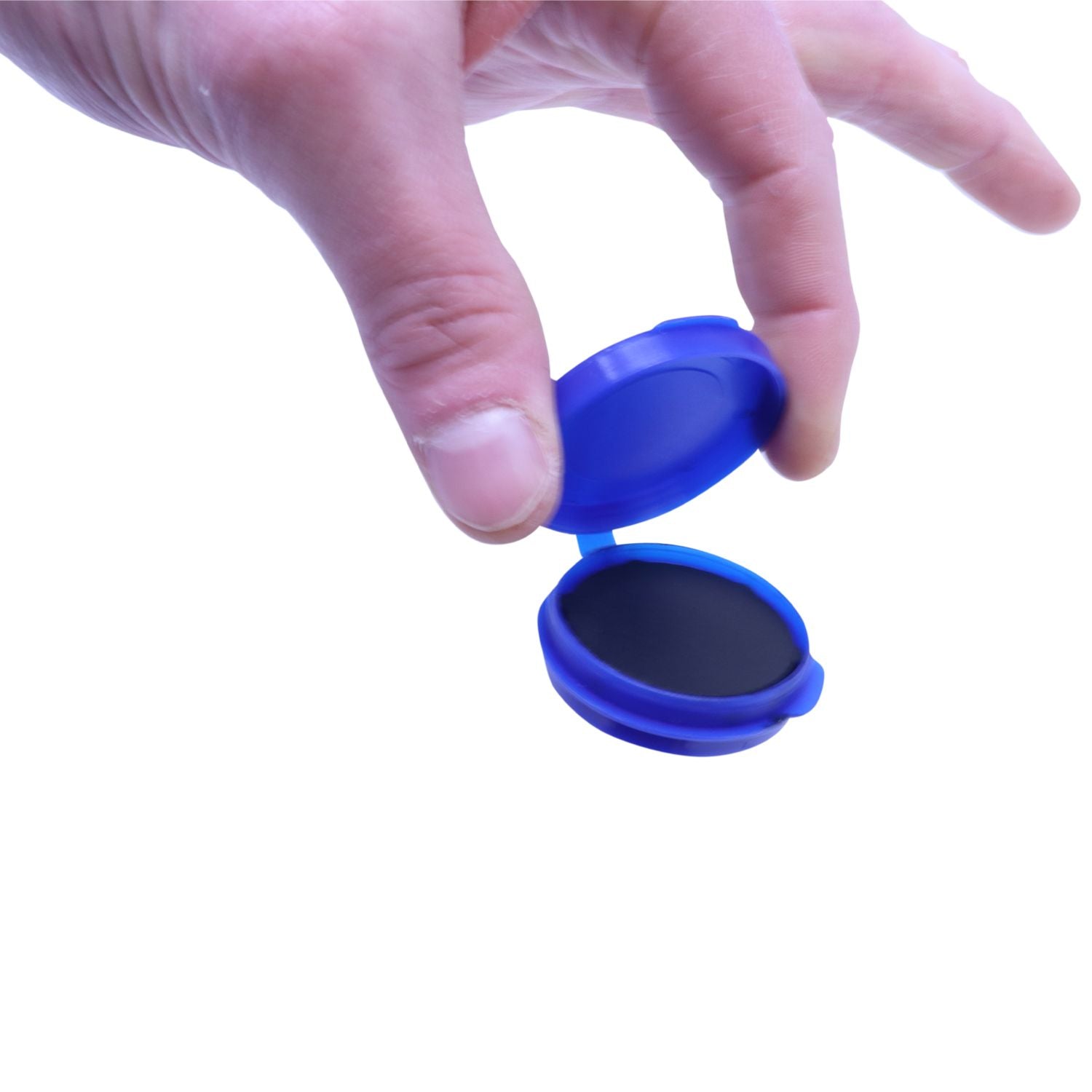 A hand holding a blue Notary Fingerprint Pad with the lid open, revealing the black ink pad inside.