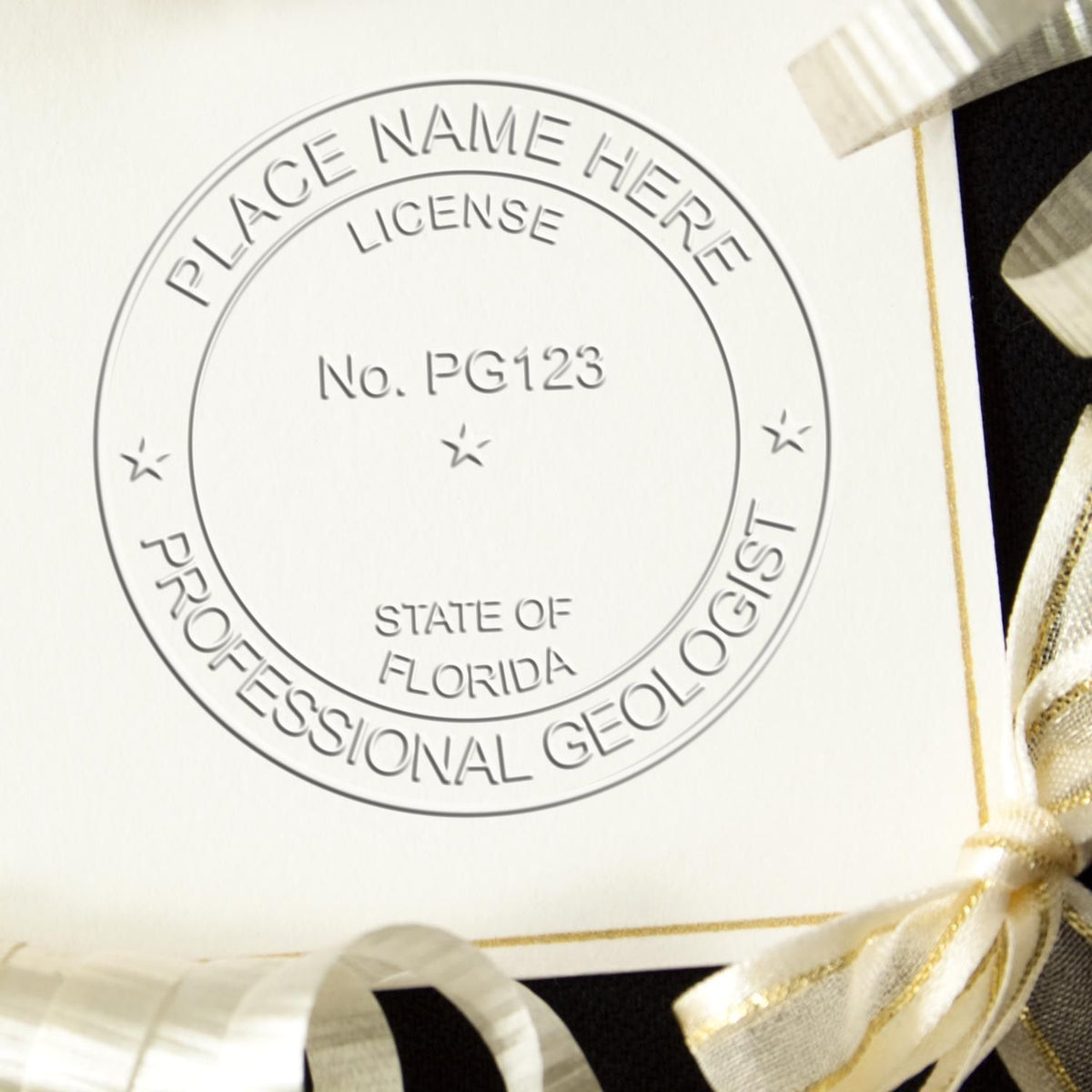 An in use photo of the Gift Florida Geologist Seal showing a sample imprint on a cardstock