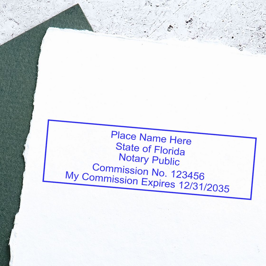 An alternative view of the Heavy-Duty Florida Rectangular Notary Stamp stamped on a sheet of paper showing the image in use