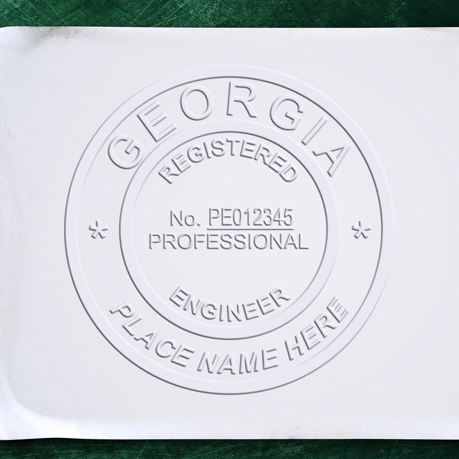 The main image for the Handheld Georgia Professional Engineer Embosser depicting a sample of the imprint and electronic files