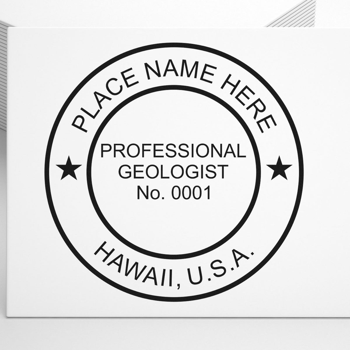 A lifestyle photo showing a stamped image of the Premium MaxLight Pre-Inked Hawaii Geology Stamp on a piece of paper