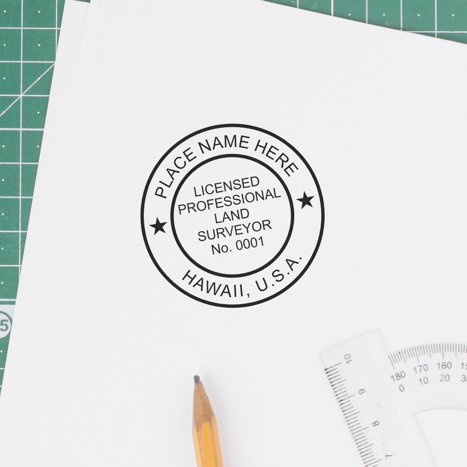 Land Surveyor Slim Pre-Inked Rubber Stamp of Seal in use on a white paper, with a pencil and ruler nearby on a green cutting mat.