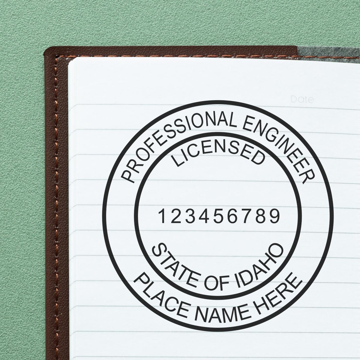 A lifestyle photo showing a stamped image of the Digital Idaho PE Stamp and Electronic Seal for Idaho Engineer on a piece of paper