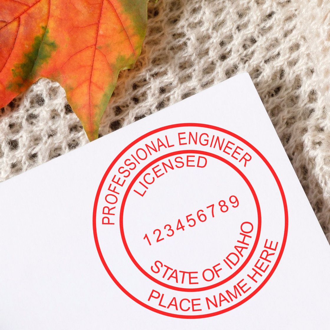 A lifestyle photo showing a stamped image of the Idaho Professional Engineer Seal Stamp on a piece of paper