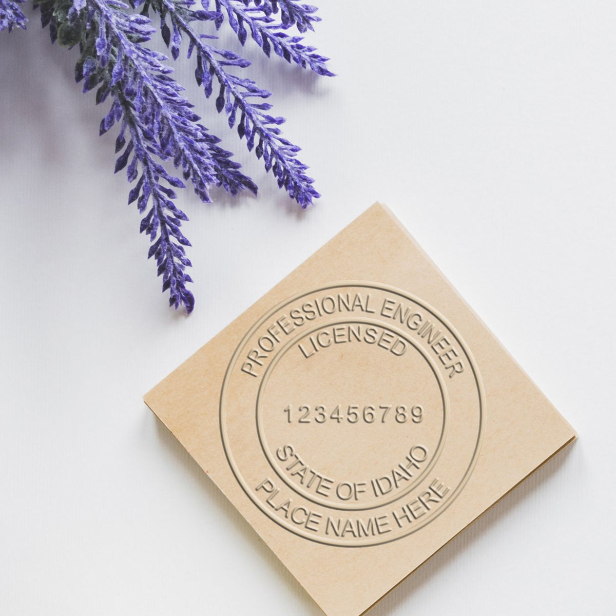 A stamped impression of the State of Idaho Extended Long Reach Engineer Seal in this stylish lifestyle photo, setting the tone for a unique and personalized product.