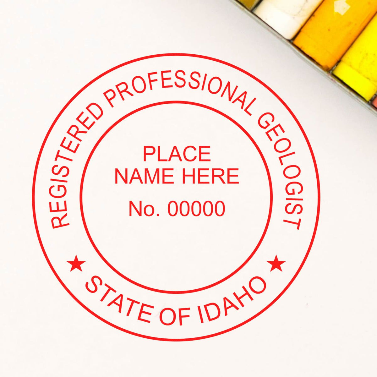 An in use photo of the Slim Pre-Inked Idaho Professional Geologist Seal Stamp showing a sample imprint on a cardstock